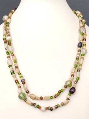 Long single strand brown, green and cream glass bead necklace